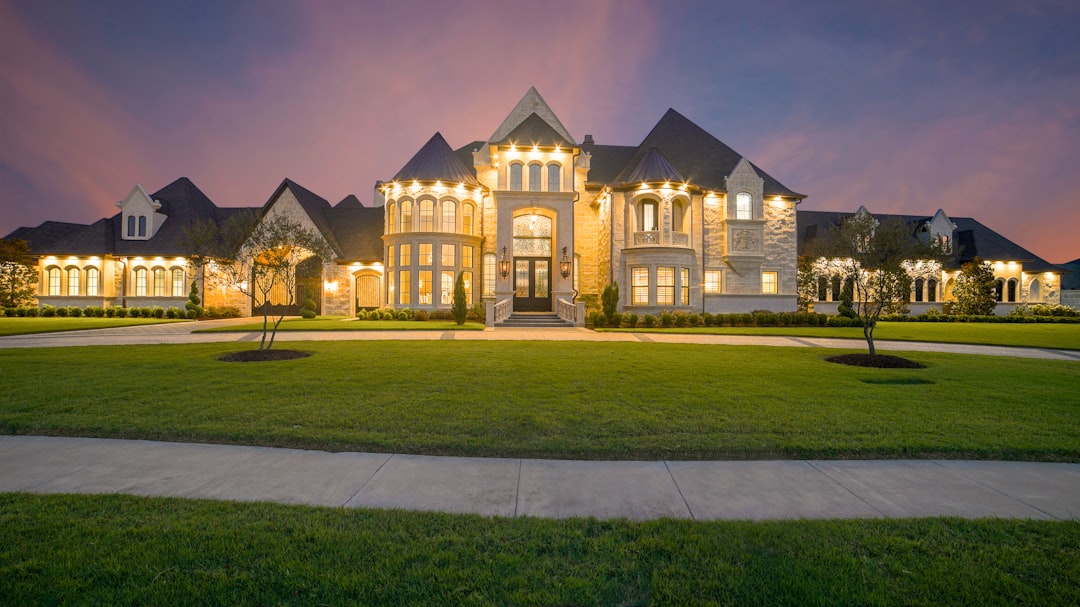 Illuminated luxury mansion at dusk
